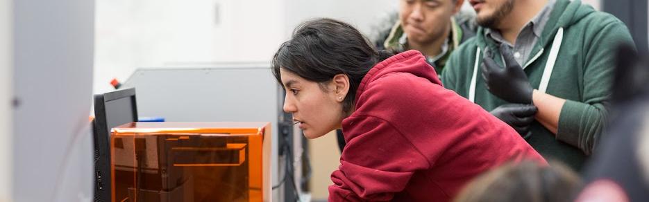 student working with 3d printer