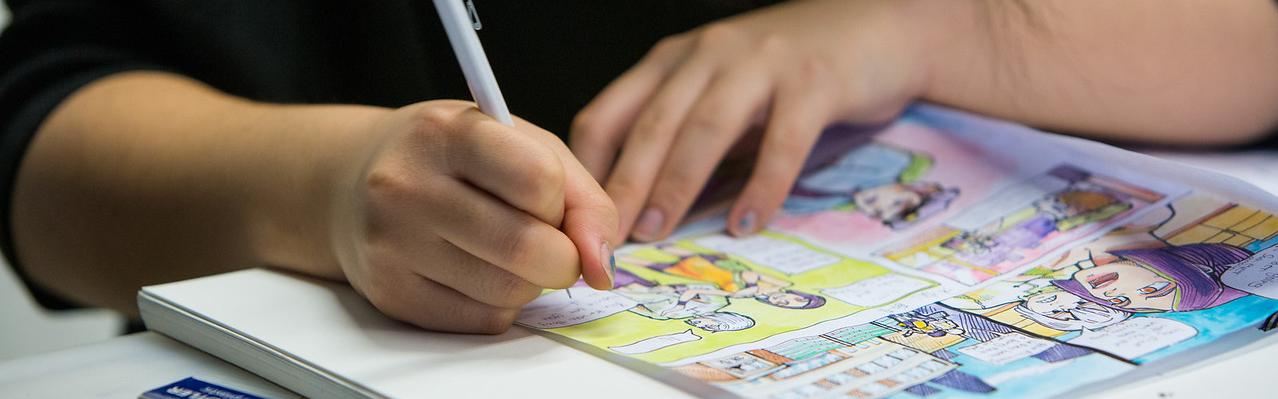 illustrator working on a comic