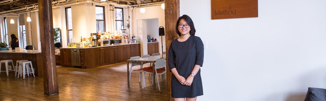 student posing at their summer internship