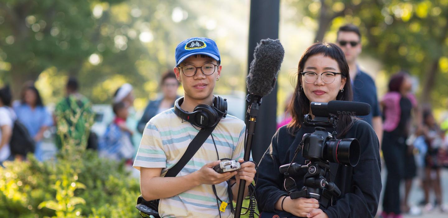 Students with camera equipment during a pro photo shoot
