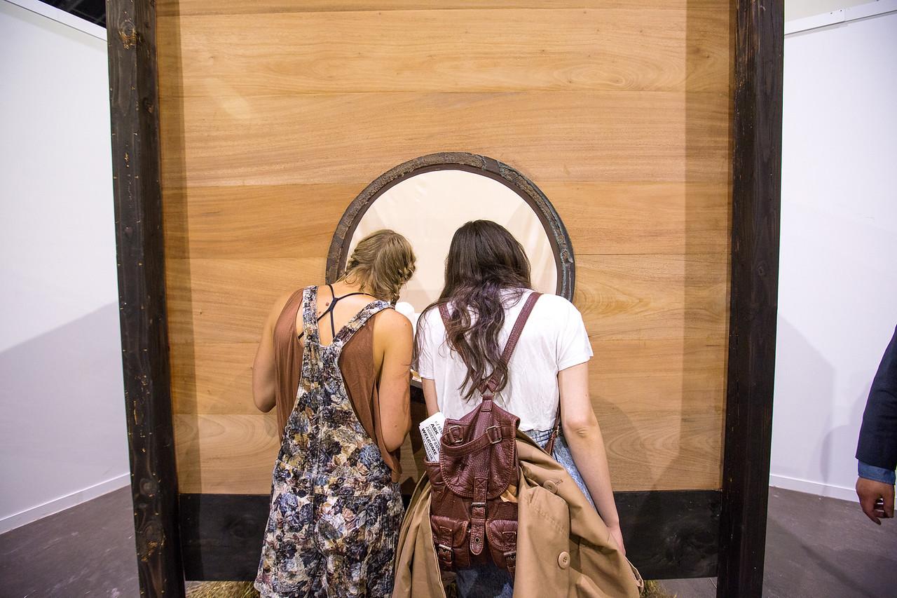 students looking through an installation