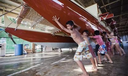 kids learning traditional canoeing techniques